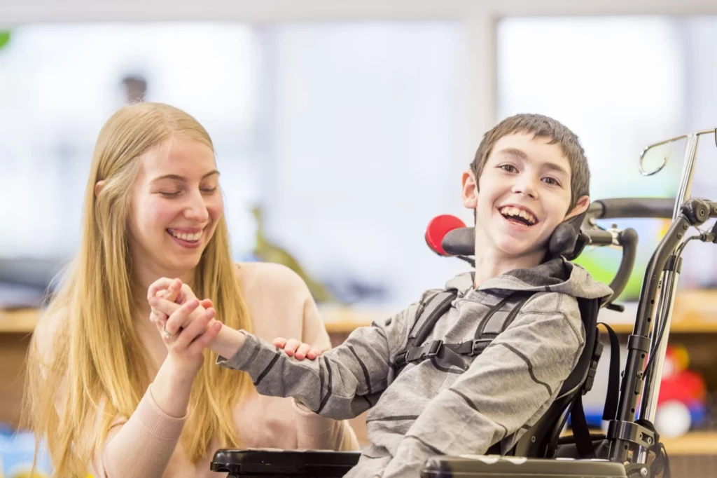 A child with cerebral palsy confidently maneuvering a wheelchair