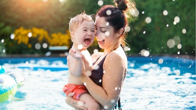 Image of a mom with her child in a pool, demonstrating parenting tips for water activities